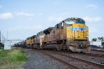 UP 8488 leads a manifest towards the BNSF Diamond